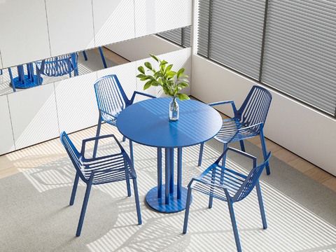 cassina Klein blue round dining table and chairs