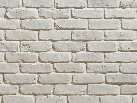 White distressed brick wall surface