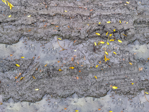 Seamless yellow wet dirt road ground