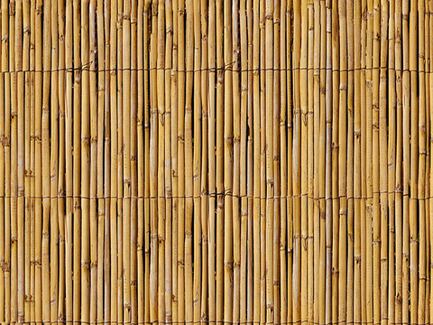 Seamless yellow distressed bamboo pole bamboo fence