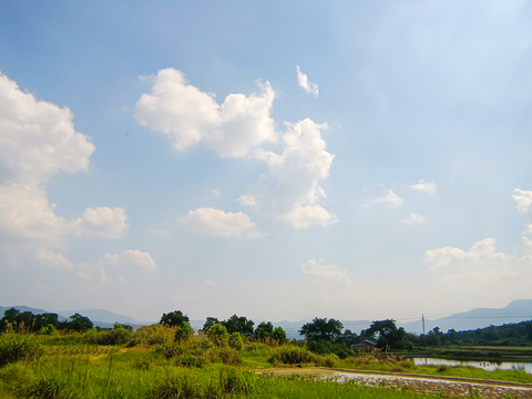 sky outdoor countryside distant mountains