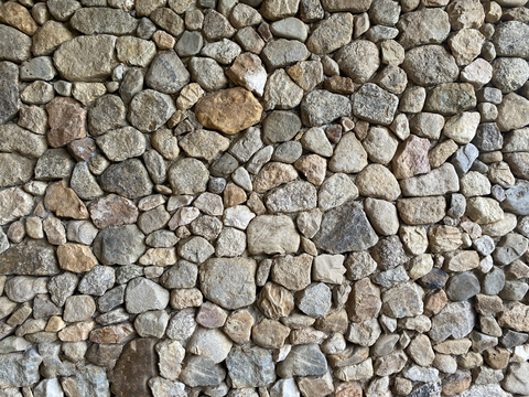 Polygonal irregular dry base stone rubble wall