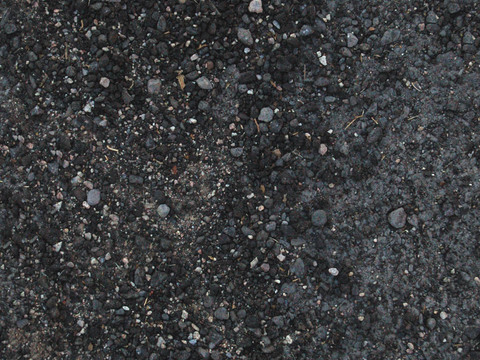 Seamless black gravel gravel ground pavement