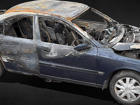 The wreck of a burned-out car